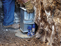 Securing a foundation footing bracket for a foundation repair system in Seymour.