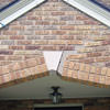 Major tuckpointing on a home archway over a door, with tuckpointing several inches wide that has failed on a Knoxville home