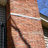 A tilting chimney on a Fort Oglethorpe home with a leaning, tilting chimney that was temporarily repaired.