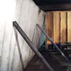 Temporary foundation wall supports stabilizing a Cleveland home