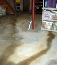 Flooding entering a basement through a floor crack in Sevierville