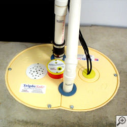 A sump pump system installed along a basement floor in Knoxville.