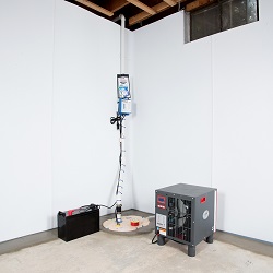 Sump pump system, dehumidifier, and basement wall panels installed during a sump pump installation in Maryville
