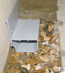 A no-clog basement french drain system installed in Powell