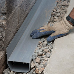 installing a drain tile system in a Greeneville home